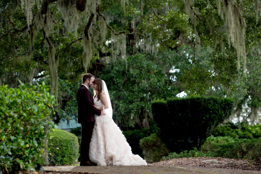 Bride & Groom embrace in a beautiful wedding portrait at Heritage Plantation. 
