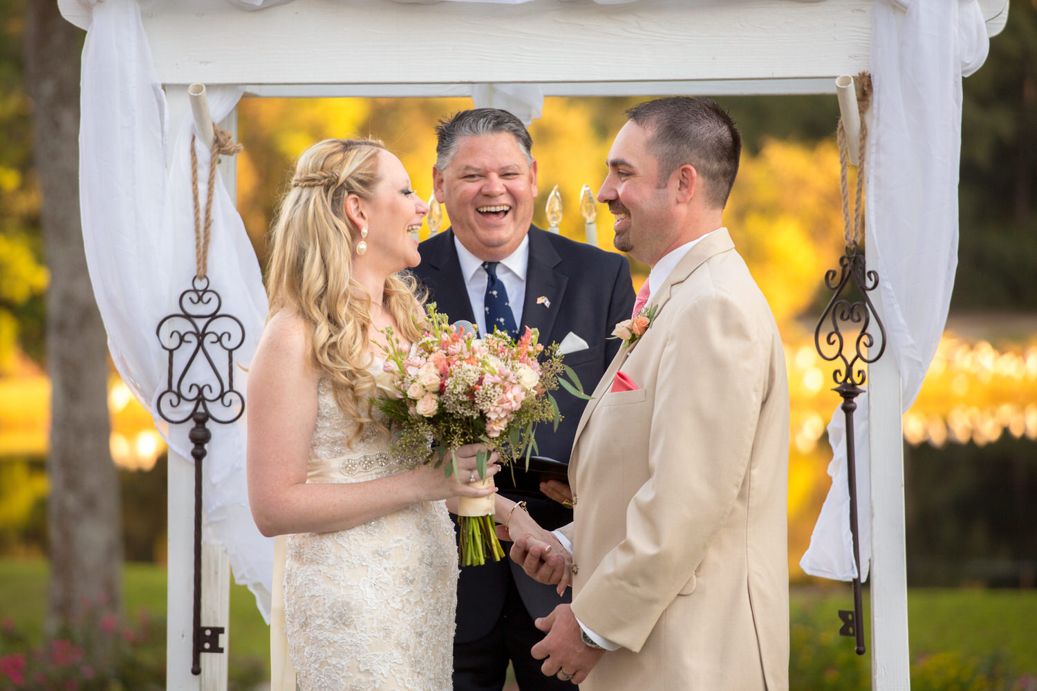 Bride & Groom share a laugh during their wedding ceremony at Pawleys Plantation in Pawleys Island, SC. 