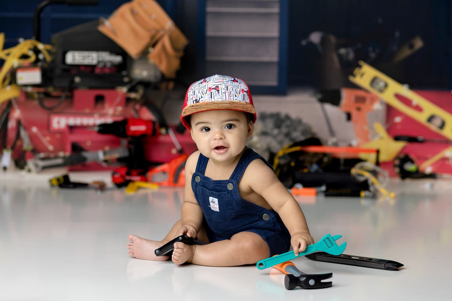 6 month old baby boy on a tool themed photo set